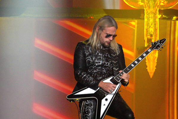 Judas Priest guitarist Richie Faulkner performing live.