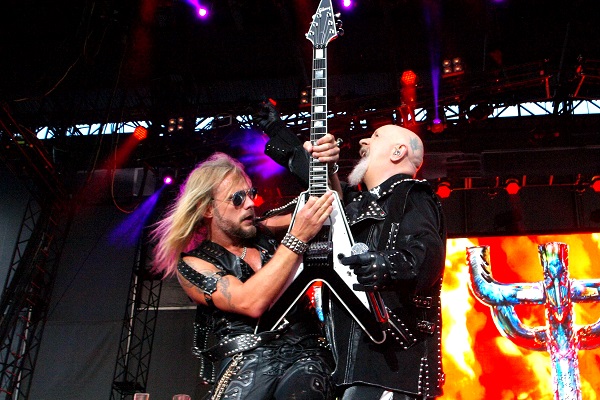 Image of Judas Priest singer Rob Halford and guitarist Richie Faulkner performing live.