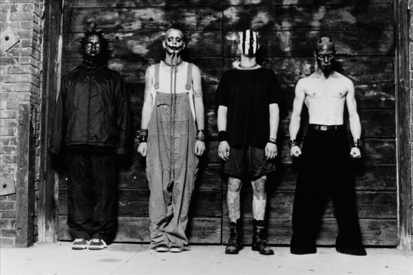 A retro, black and white press photo of nu-metal band Mudvayne, featuring the guys in masked attire.