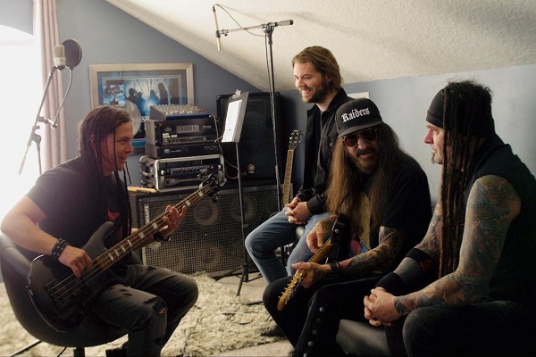 A photo of nu-metal band Saliva in the studio working on new music.