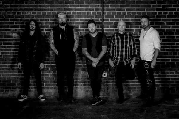 Mississippi rock band Saving Abel stand for a 2021 promo photo.