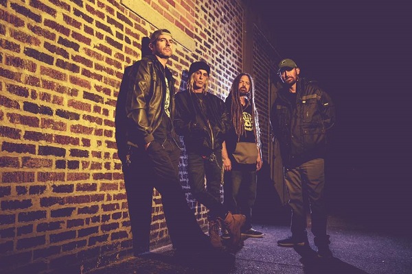 A photo of Mount Pleasant, Michigan, metal band Nagazi standing against a brick wall.