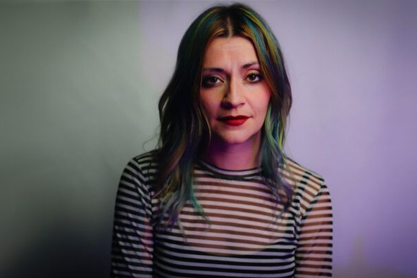 Promo photograph of Lacey Sturm, formerly of Flyleaf, with a striped black-and-white shirt.