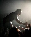 Shinedown vocalist Brent Smith reaching into the crowd on tour.