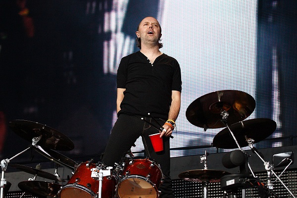 Lars Ulrich of Metallica stands atop his drum kit during a Metallica concert in Detroit, Michigan.