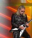 Judas Priest guitarist Richie Faulkner performing live.