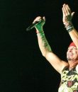 Poison frontman Bret Michaels clapping his hands and performing at DTE Energy Music Theatre in Clarkston, Michigan, in 2018. Tour 2018