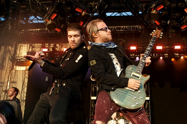 Shinedown band members Brent Smith and Zach Myers performing live onstage at DTE Energy Music Theatre in Clarkston, Michigan.