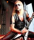 Judas Priest guitarist Richie Faulkner performing live.