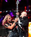 Image of Judas Priest singer Rob Halford and guitarist Richie Faulkner performing live.