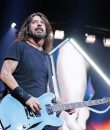 Dave Grohl of Foo Fighters performing with his baby blue, Gibson ES-335.
