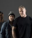 Metallica promo photos, featuring James Hetfield, Kirk Hammett, Lars Ulrich and Robert Trujillo, dressed in black and gray.