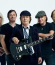 AC/DC standing amid a white background.