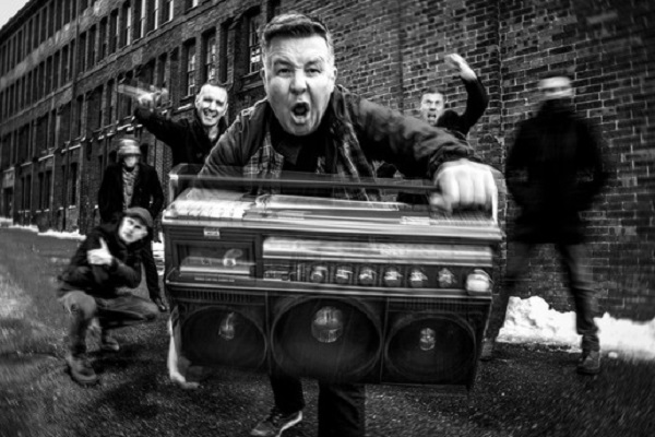 Dropkick Murphys pictured on a city street, in black and white.