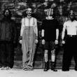 A retro, black and white press photo of nu-metal band Mudvayne, featuring the guys in masked attire.