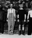 A retro, black and white press photo of nu-metal band Mudvayne, featuring the guys in masked attire.