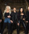 Butcher Babies promo photo, featuring the band in a rustic setting.