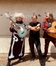 The Melvins rocking out in a colorful press photo.