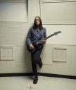 Jeff Schroeder of The Smashing Pumpkins slinging his six-string guitar.