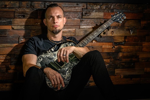 Mark Tremonti of Creed and Alter Bridge poses for a promo photo.