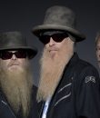 ZZ Top promo image featuring the band members amid a dark background.