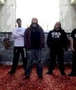 Detroit metal band Centenary posting in an abandoned building.