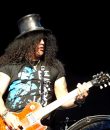 Photo of Slash performing live at DTE Energy Music Theatre in Detroit, Michigan.