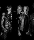 Queens of the Stone Age black and white promo photo.