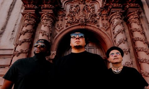 Image of rap-rock band P.O.D. standing in a castle-looking building.