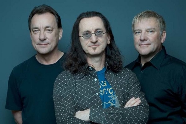 Photo of the Canadian rock band Rush, with a blue background.