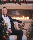 Image of Mark Tremonti of Creed and Alter Bridge by a Christmas tree.