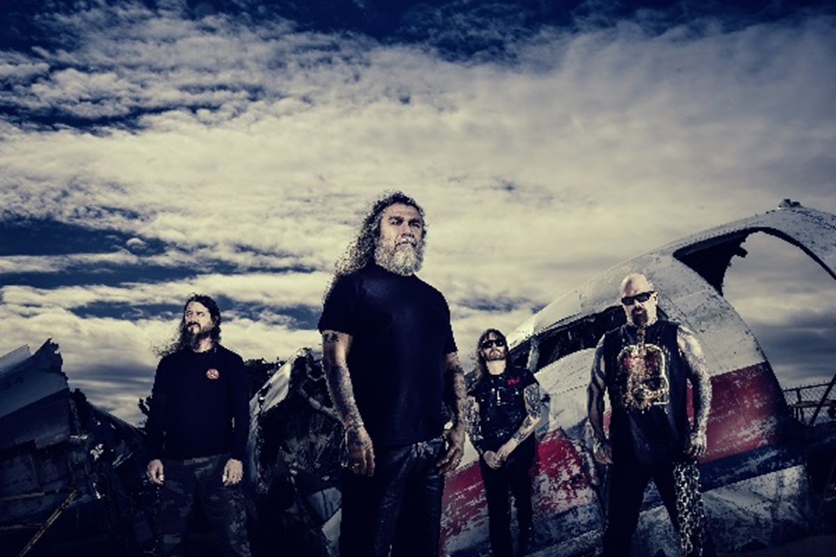 Image of Slayer standing outside on a cloudy day.