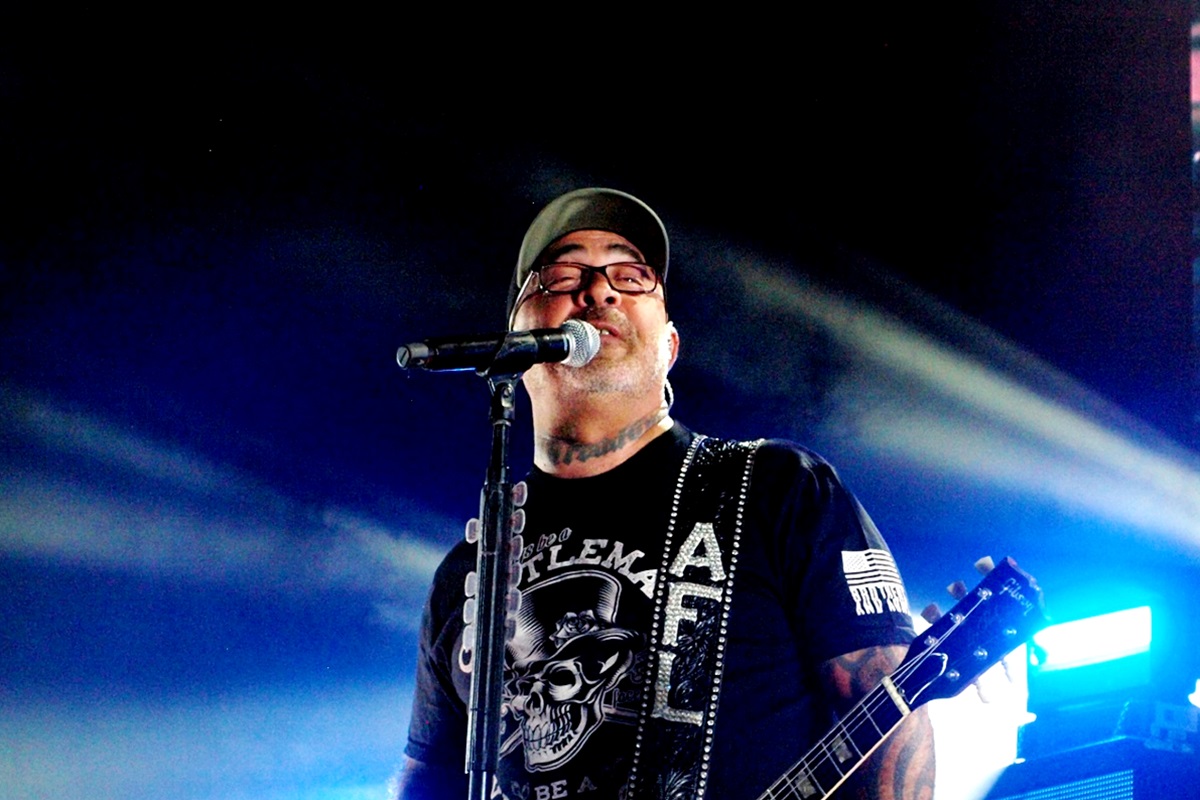 Aaron Lewis of Staind performing live with blue lighting.