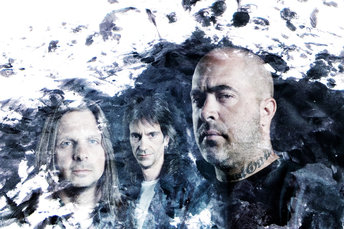 Image of Staind band members with grunge art decals. 
