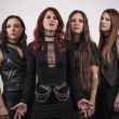 Photo of metal band Kittie posting with black clothing.