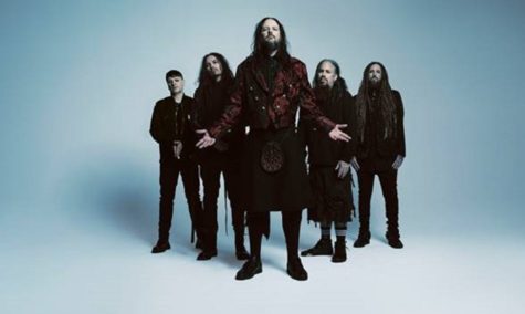 Original photo of Korn standing for a posed photo.