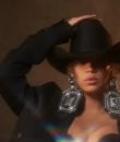 Beyonce posing with a cowboy hat. This is a Beyonce review of "Cowboy Carter."