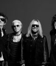 Black and white photo of Motley Crue. Here's our Motley Crue, "Dogs of War" song review.