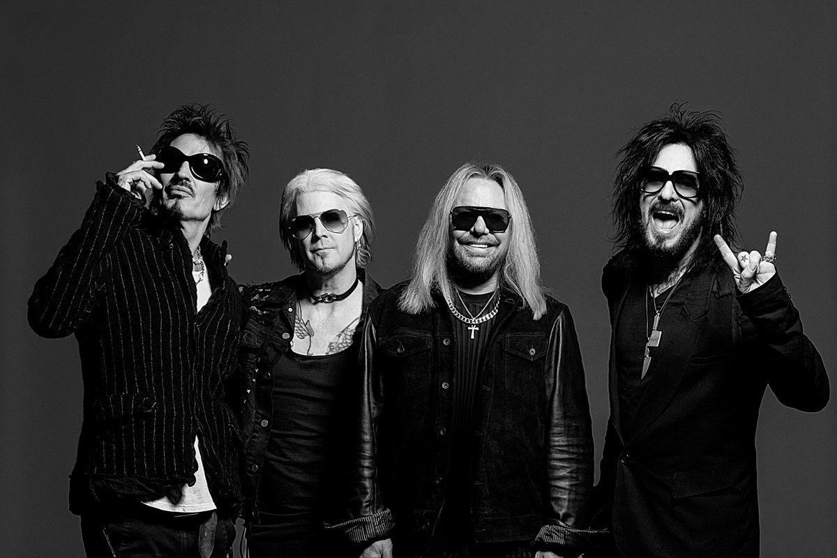 Black and white photo of Motley Crue. Here's our Motley Crue, "Dogs of War" song review.