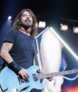 Dave Grohl and Foo Fighters performing live. This story is about, "How did Foo Fighters get their name?"