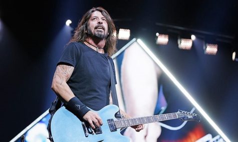 Dave Grohl and Foo Fighters performing live. This story is about, "How did Foo Fighters get their name?"