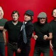 AC/DC with a red background. Experts have analyzed music data to determine the most popular drinking songs of all time.