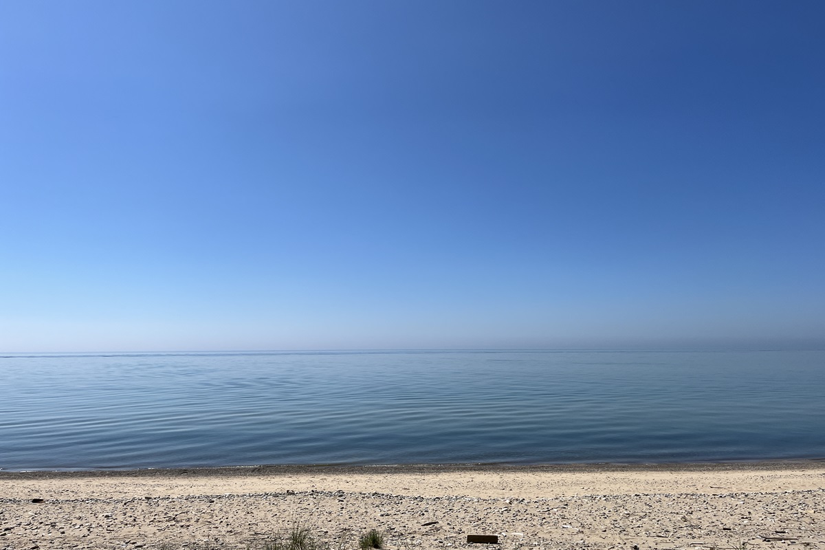 Lake Michigan in the summer. Here are some of the best beach songs to get on your summer playlist.