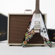 The Epiphone Jimi Hendrix "Love Drops" Flying V, which features a recreation of the psychedelic graphics that Hendrix hand-painted on his original guitar.